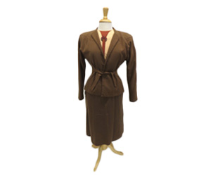 Chocolate brown woven wool suit. Suit jacket has shoulder pads and skirt has inverted pleats down the front.