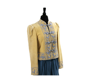 Tan jacket with ethnic blue embroidery with coordinating pants and skirt.